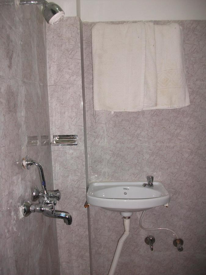 Holy City Inn Варанасі Номер фото